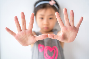 little girl open her hands  showing her ten fingers mean something.