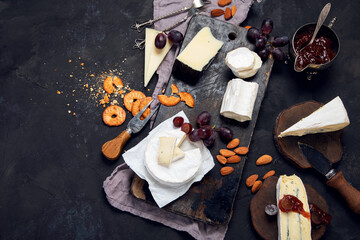 Cheese board on dark background.