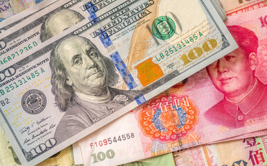 currencies of dollar, yuan and another money