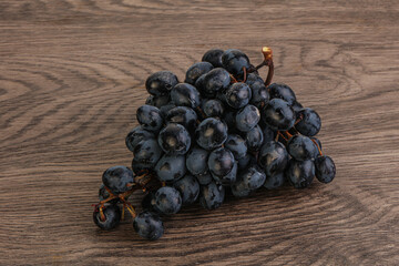 Purple grape branch over background