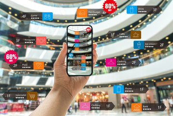 Augmented reality marketing in the shopping mall. Hand holding smart phone use AR application to check information