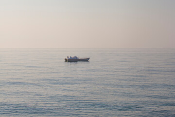 Naklejka premium Empty pedal-boat floating in the sea
