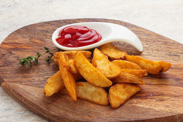 Fried rustic potato with tomato ketcup