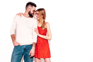 Sexy smiling beautiful woman and her handsome boyfriend. Happy cheerful family having tender moments near pink wall in studio.Pure cheerful models hugging.Embracing each other. Cheerful and happy