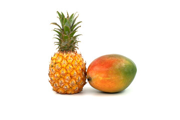 Pineapple and multicolored mango isolated on a white