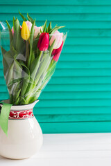 Blurred tulips wooden background