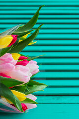 Blurred tulips bouquet wooden background