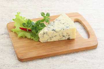 Blue cheese piece over board