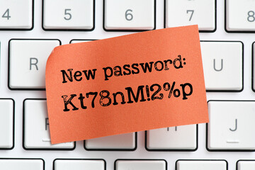 New strong password words on a red sheet of paper placed on a computer keyboard. It's time to...