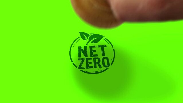 Net zero and eco friendly symbol stamp and hand stamping impact isolated. Co2 neutral, ecology, environment, carbon emissions reduction and green energy 3D rendered concept. Alpha matte channel.