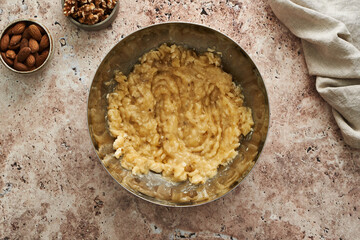 the stage of preparation of banana cake with nuts