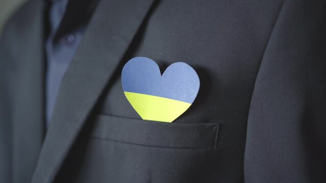 Ukraine flag color heart in suit pocket