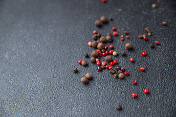 peppercorn mix black, pink, allspice pepper spices healthy meal food diet snack on the table copy space food background rustic top view