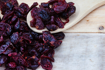 dried cranberries on rustic surface with copy space