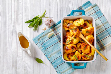 roasted squashed potatoes with garlic and sage