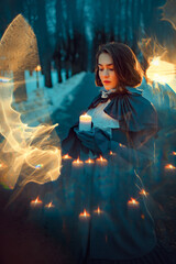 Vintage young woman with the candle in the park