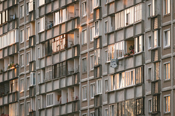 Reflection of a sunset in Soviet multistory building windows in Riga, Latvia