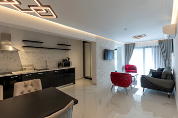 Interior of a modern apartment with black and white furniture