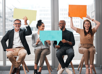 Lets untuck that opinion you stashed away. Shot of a group of young businesspeople holding speech...