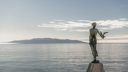 Statue of a girl with a seagull in Opatija