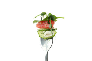 Fork with salad with red orange isolated on white background