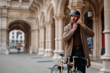 Hipster putting on a helmet. Safety bicycle transport