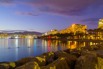 Evening view of the promenade, with hotel buildings. Eilat