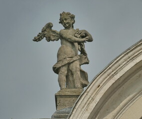 Fototapeta na wymiar Statue on San Giorgio church, Treviolo, Bergamo, Lombardy, Italy.