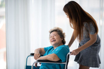health insurance concept, young Asian woman are visit her senior family patient at hospital room,...