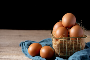 fresh chicken eggs in a metal basket