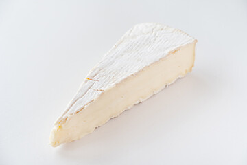 Cut pieces of whole and sliced camembert cheese