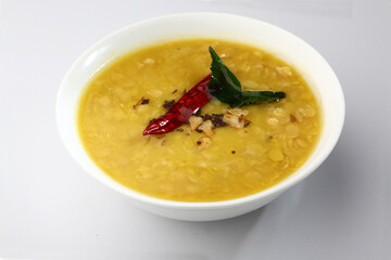 Indian food tuvar Daal or yellow lentil soup or curry in  ceramic bowl  