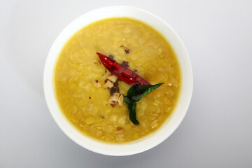 Indian food tuvar Daal or yellow lentil soup or curry in  ceramic bowl  
