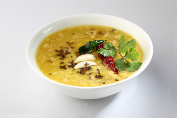 Indian food tuvar Daal or yellow lentil soup or curry in  ceramic bowl  