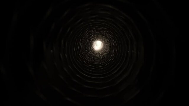 4K: Light at the end of the tunnel. Travelling through a passage or tube to brightness. Tracking motion with probe lens. Stock video clip footage