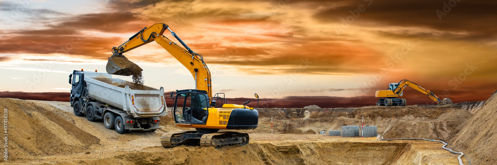 Wall mural excavator is working on construction site