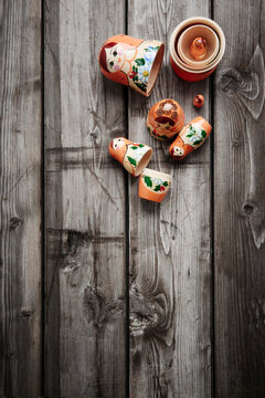 babushka doll disassembled on an old wooden table