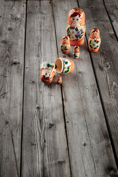 babushka doll disassembled on an old wooden table