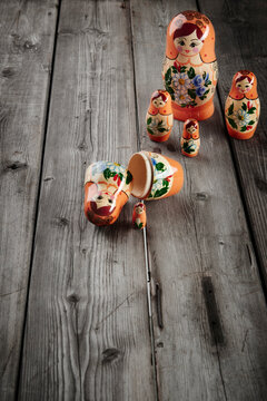 babushka doll disassembled on an old wooden table