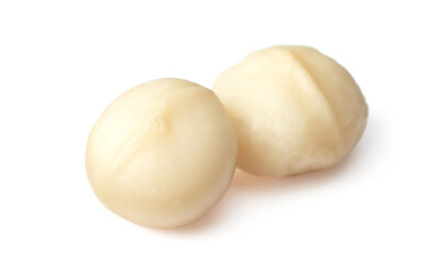 Unshelled macadamia nuts isolated on white background.