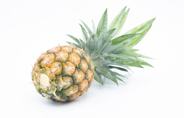Tasty whole pineapple with leaves on white background