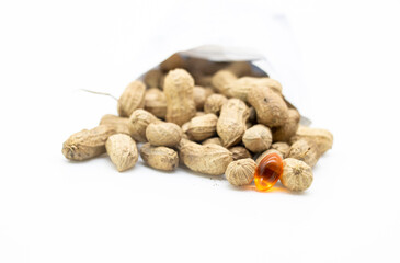 Useful peanut, close-up, isolated on white background.