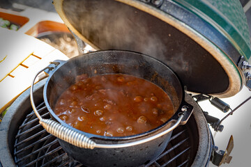 ready to eat - goulash from venison meat -  cooked on a charcoal grill at outdoor