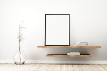 Black frame standing on rustic wooden shelf, pastel colored books, dried plant into a glass jug on floor, in bright interior living-room.3d render