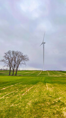 Fototapeta na wymiar Electric wind turbine generating with blue sky and turbo generator