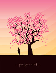 Plakat couple in love stands under a big tree at sunset