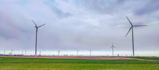 Electric wind turbine generating with blue sky and turbo generator