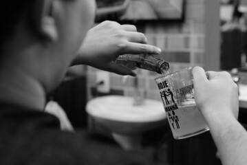 person holding a glass of beer
