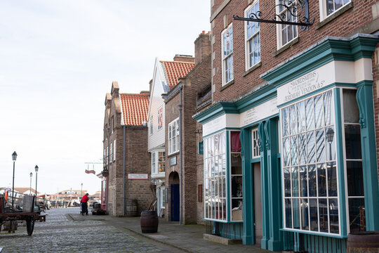 Hartlepool/UK - 11th October 2019: HMS Trincomalee wide angle photo with old style shop buildings