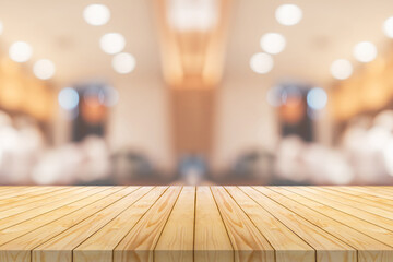 Empty wood table top with cafe restaurant interior blurred background